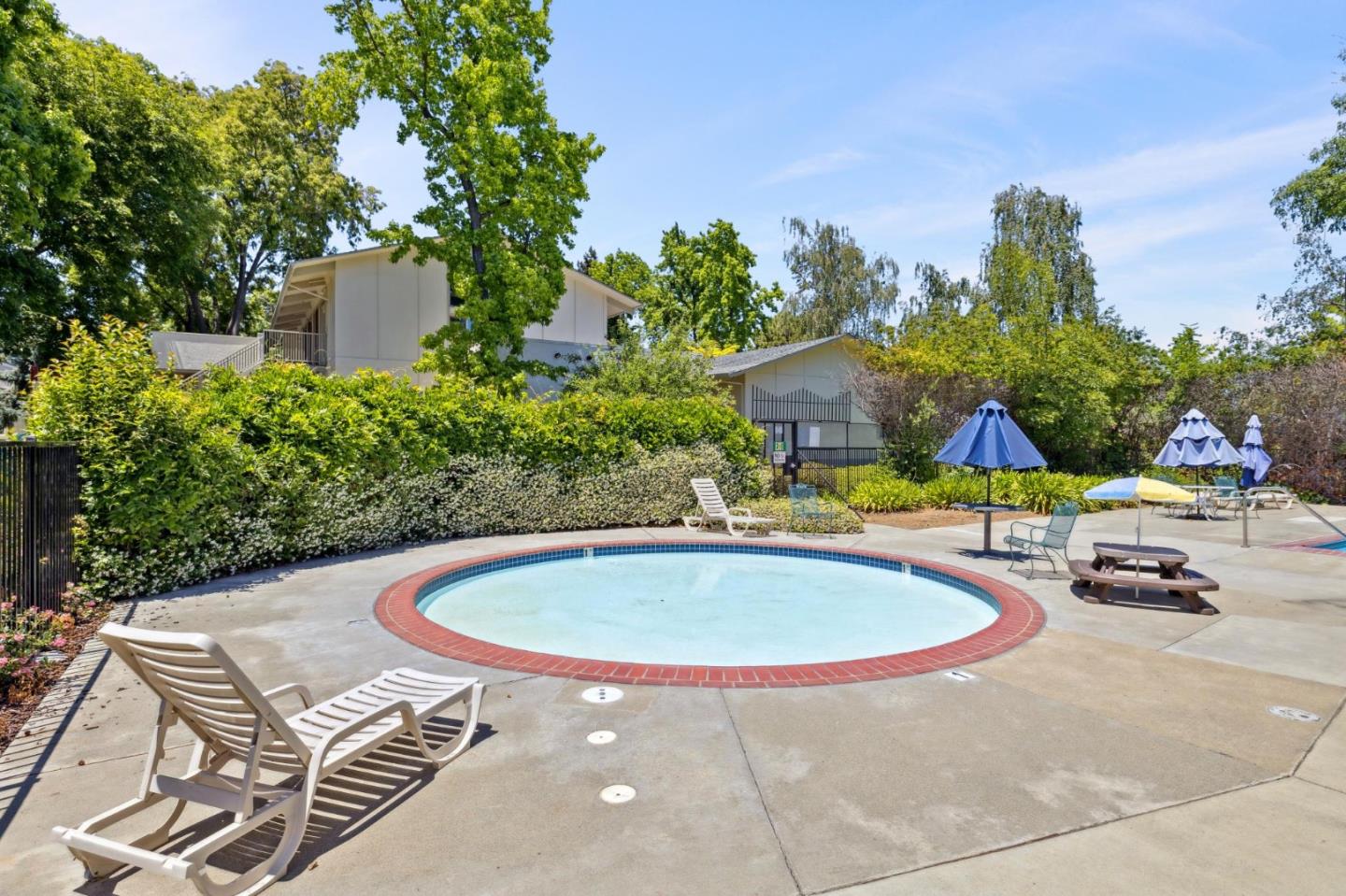 10892 Northfield Square Cupertino, CA 95014 - Photo 43 of 78 a swimming pool with outdoor seating and yard
