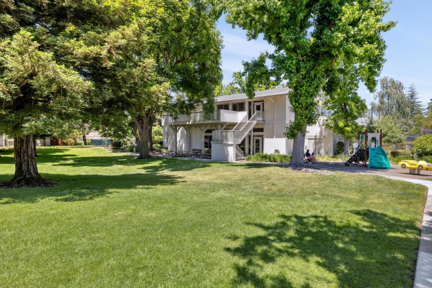 10892 Northfield Square Cupertino, CA 95014 - Photo 48 of 78 a view of a house with a big yard and large trees
