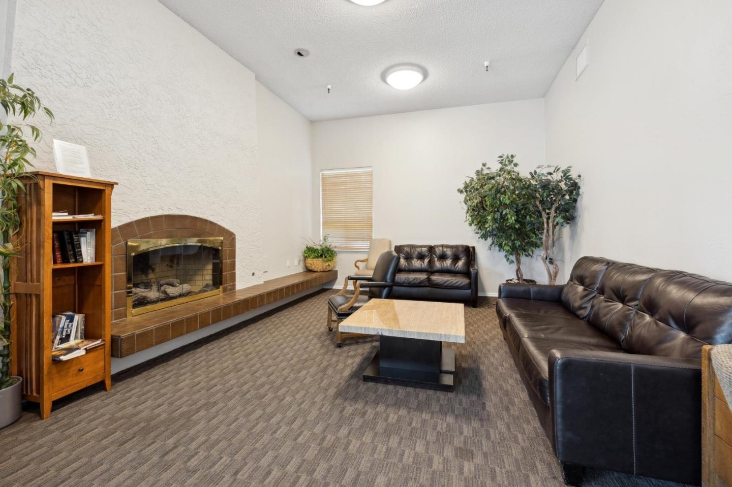 10892 Northfield Square Cupertino, CA 95014 - Photo 55 of 78 a living room with furniture and a fireplace