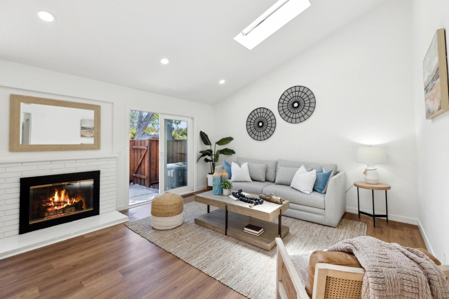 10892 Northfield Square Cupertino, CA 95014 - Photo 7 of 78 a living room with furniture and a fireplace