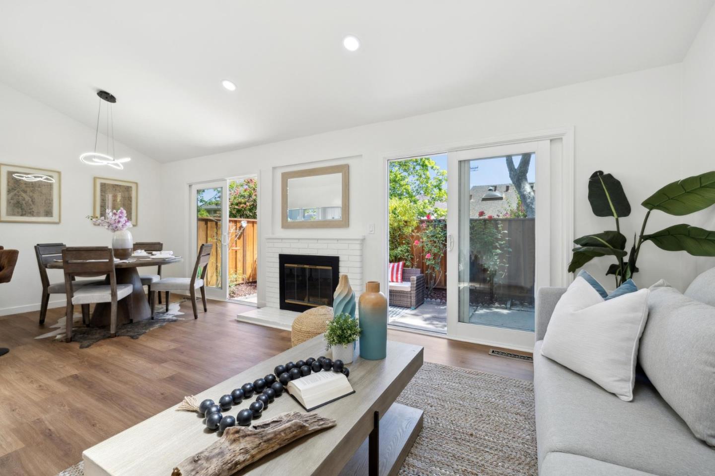 10892 Northfield Square Cupertino, CA 95014 - Photo 8 of 78 a living room with furniture a fireplace and a table
