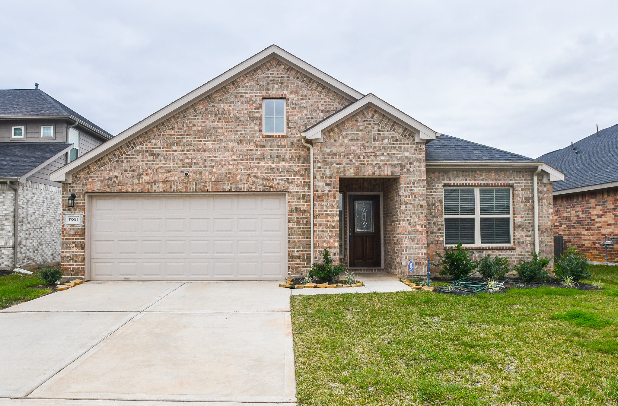 17811 Chartertree Lane Tomball, TX 77377 - Photo 1 of 32 front view of a house with a yard
