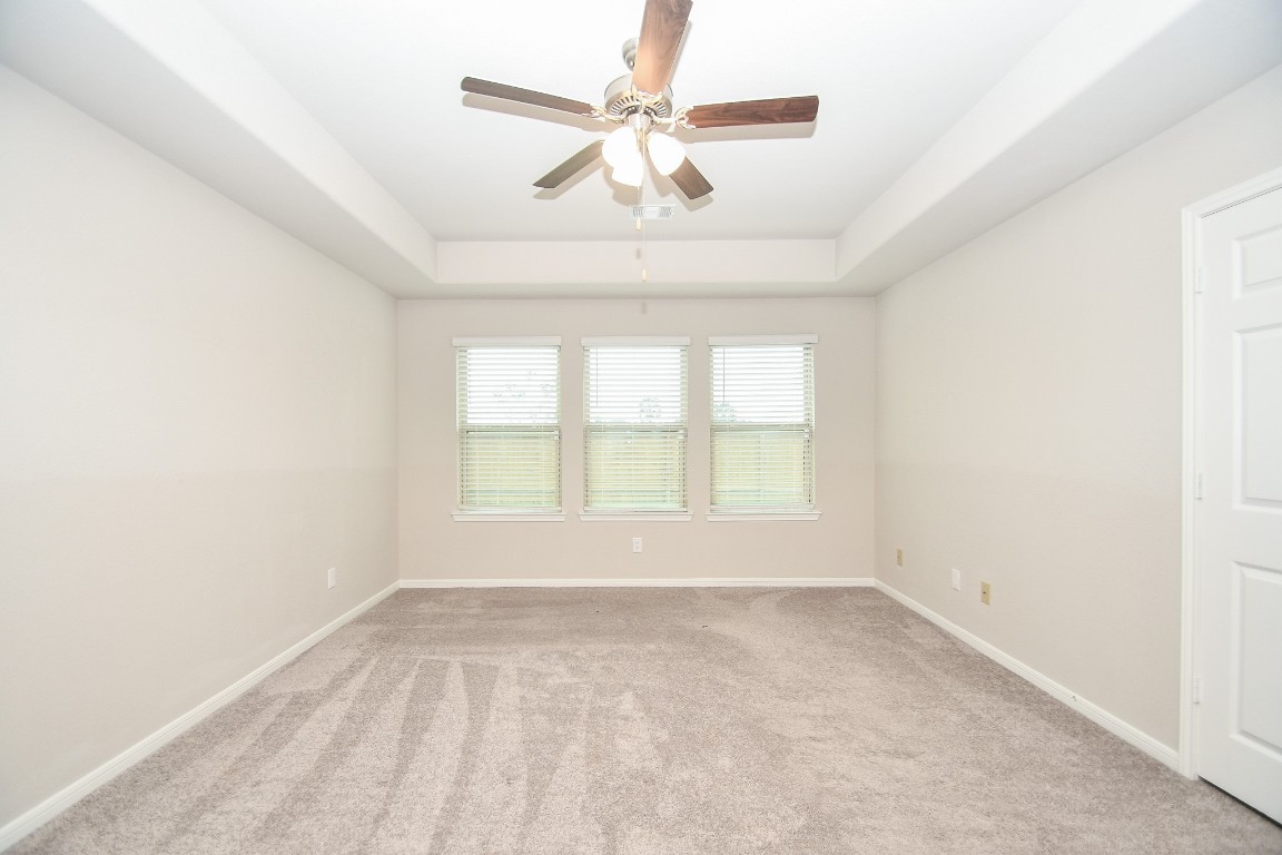 17811 Chartertree Lane Tomball, TX 77377 - Photo 16 of 32 an empty room with a window and a fan