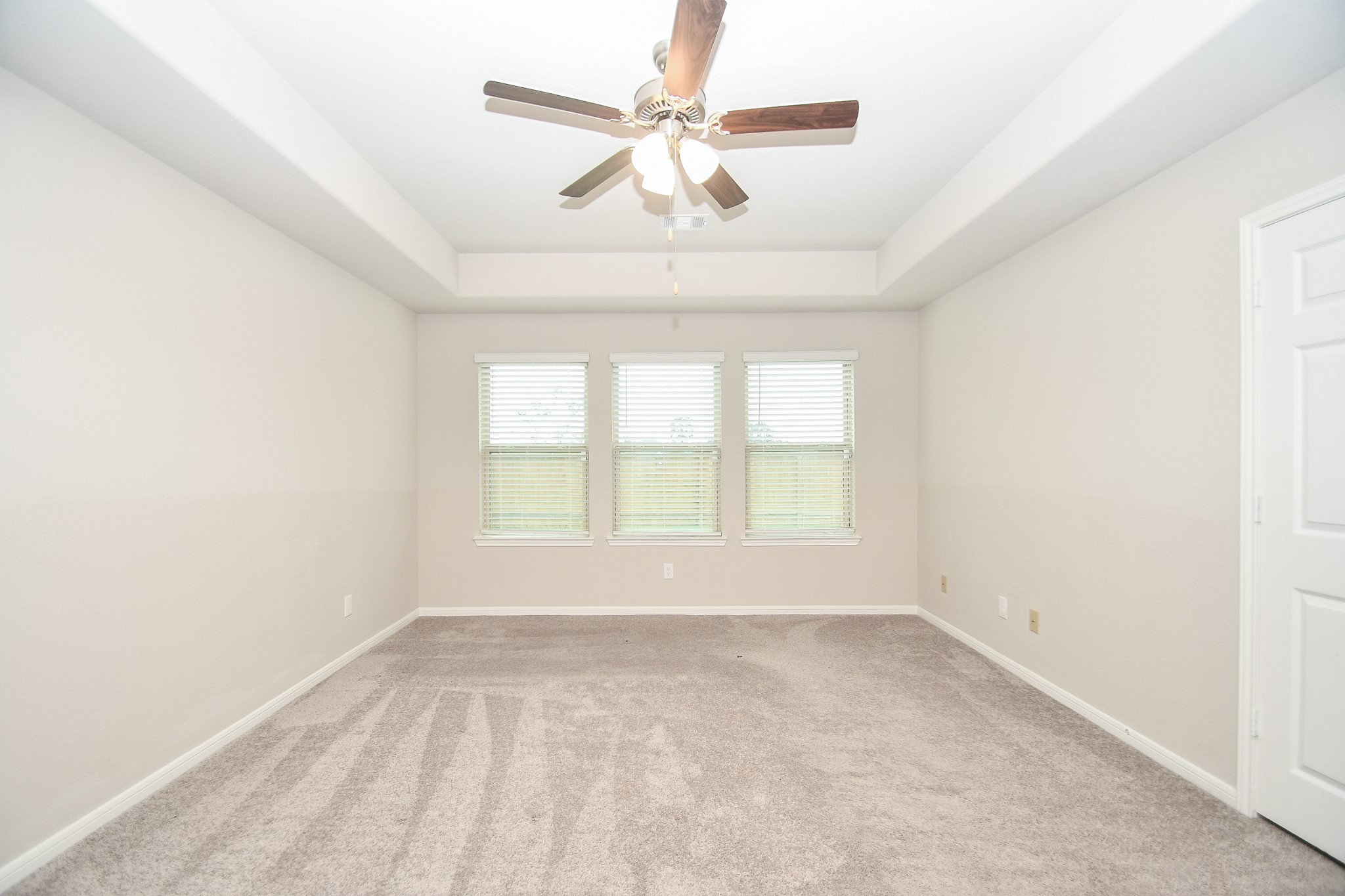 17811 Chartertree Lane Tomball, TX 77377 - Photo 16 of 32 an empty room with a window and a fan