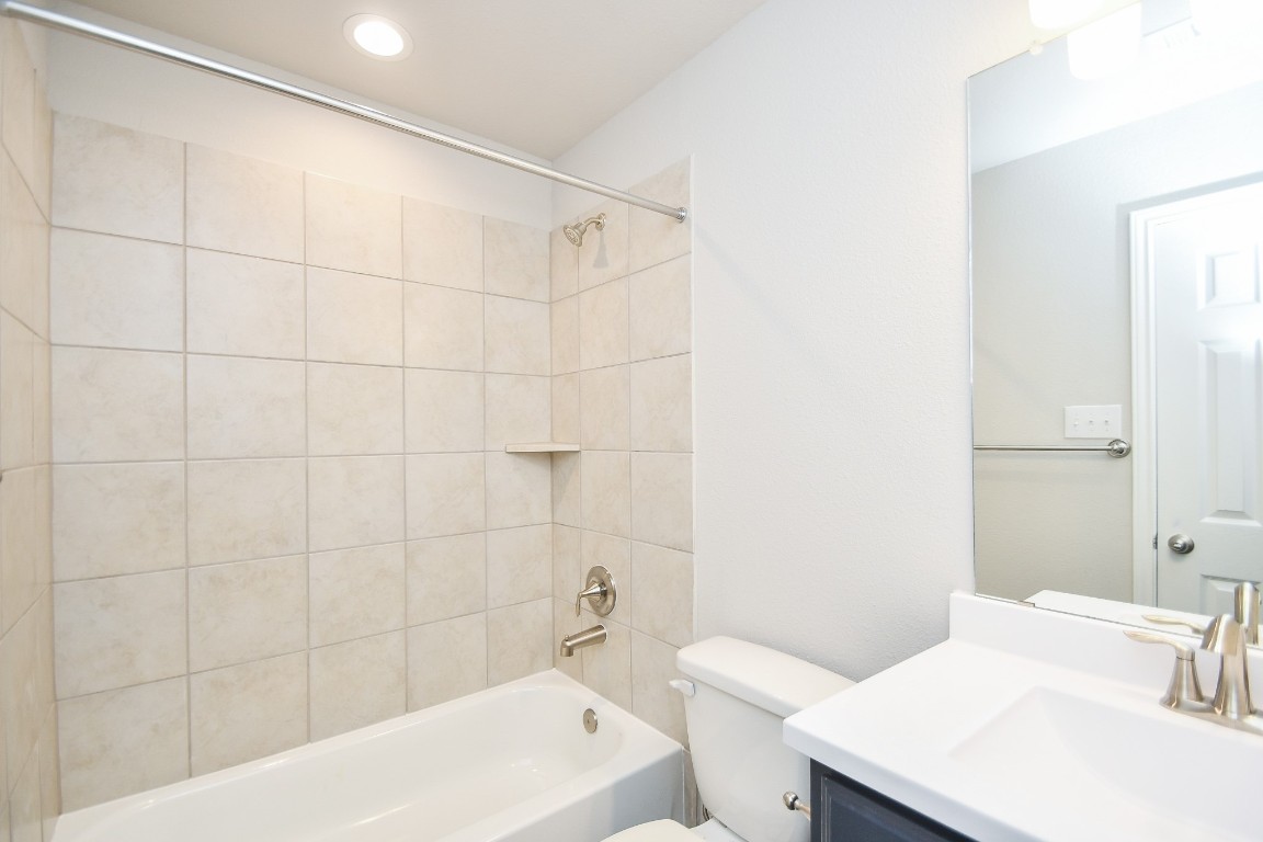 17811 Chartertree Lane Tomball, TX 77377 - Photo 26 of 32 a bathroom with a sink a toilet and shower