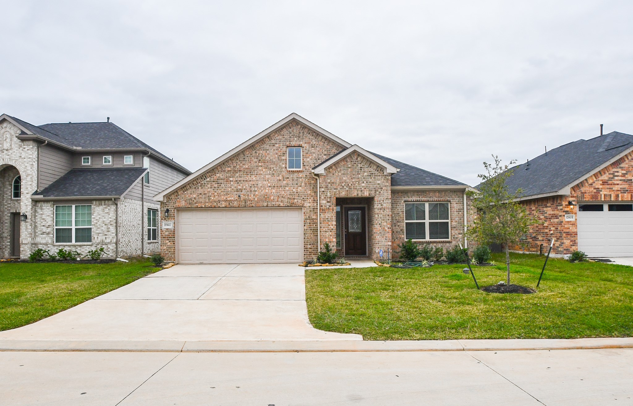 17811 Chartertree Lane Tomball, TX 77377 - Photo 3 of 32 front view of a house with a yard