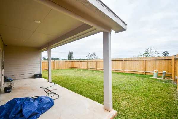 a view of a backyard with swimming pool