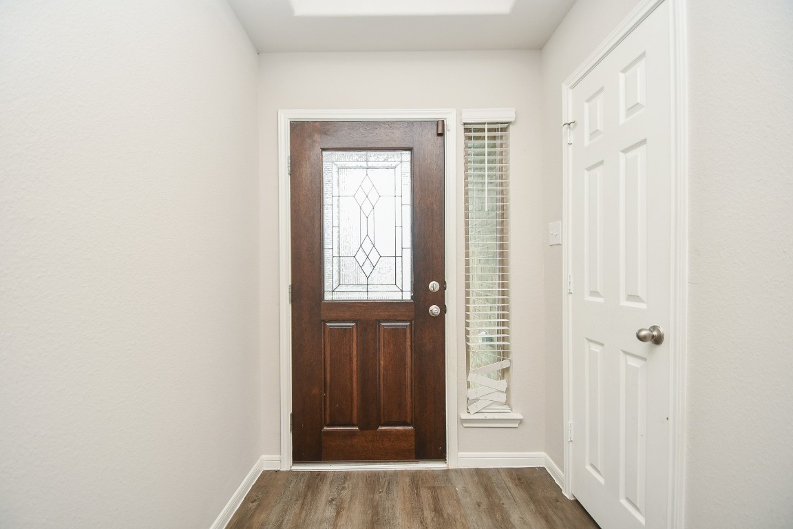 17811 Chartertree Lane Tomball, TX 77377 - Photo 4 of 32 a view of a hallway with wooden floor