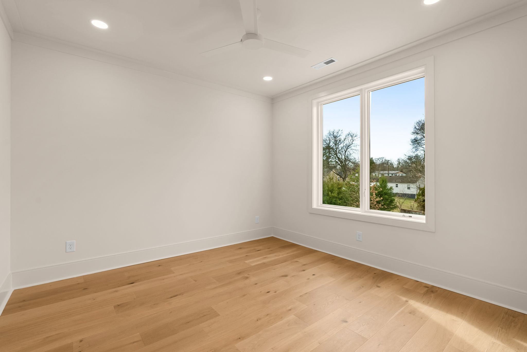 2306 Riverside Drive Nashville, TN 37216 - Photo 32 of 44 an empty room with wooden floor and windows