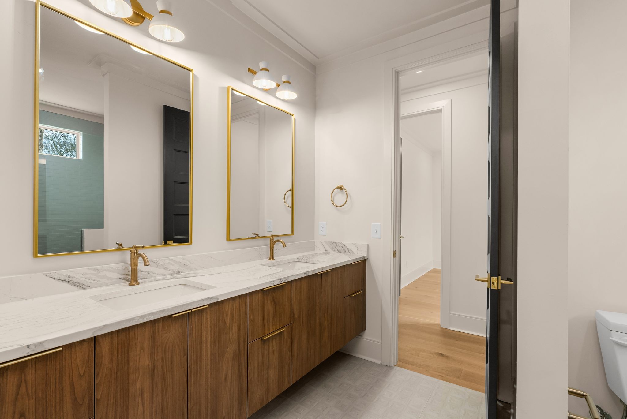 2306 Riverside Drive Nashville, TN 37216 - Photo 33 of 44 a bathroom with a double vanity sink and mirror