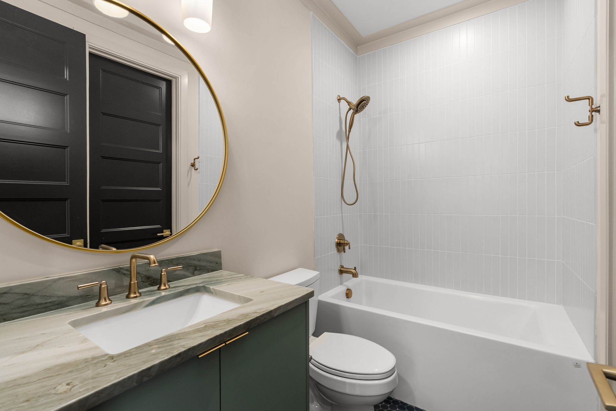 2306 Riverside Drive Nashville, TN 37216 - Photo 37 of 44 a bathroom with a granite countertop sink a toilet and shower