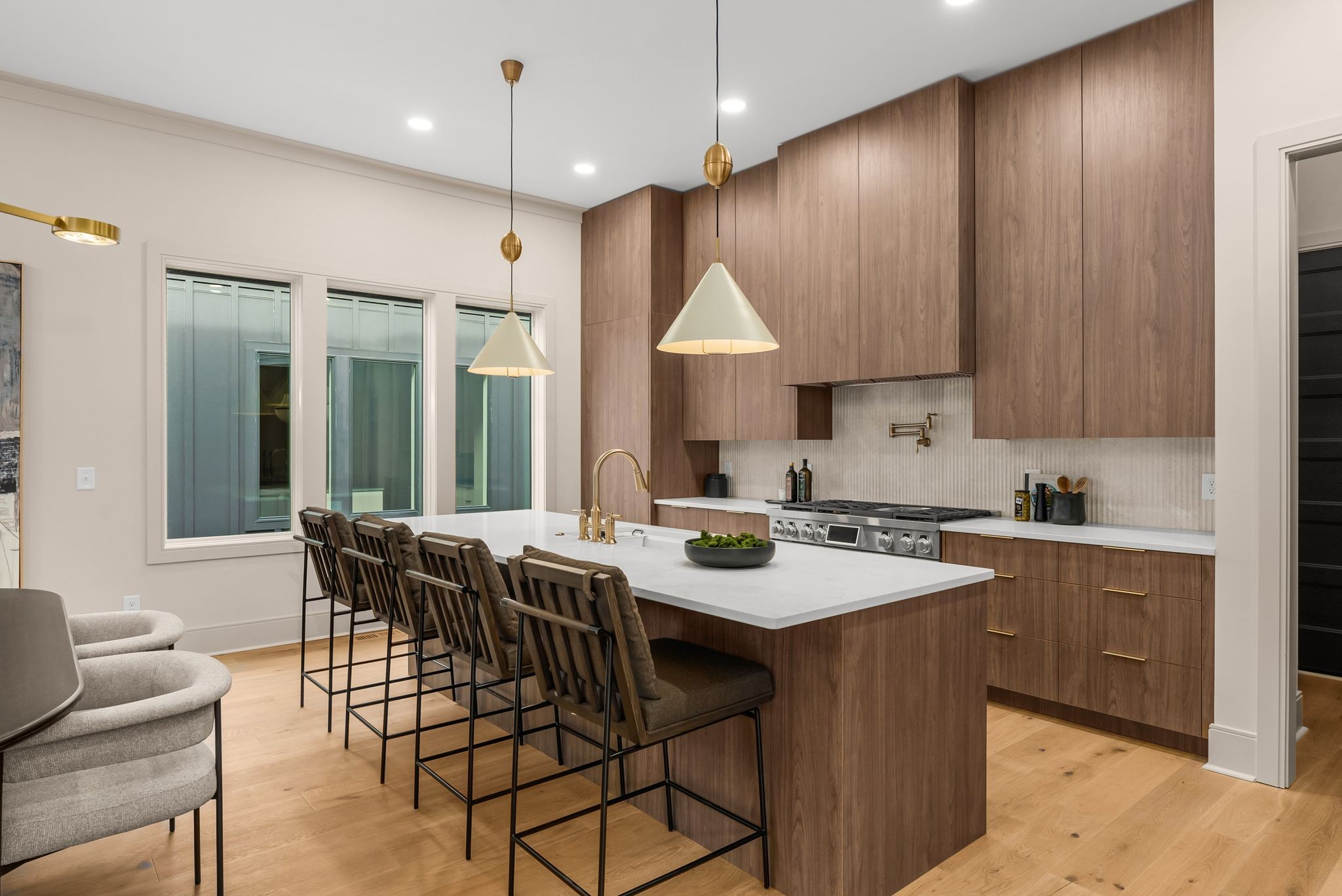 2306 Riverside Drive Nashville, TN 37216 - Photo 7 of 44 a kitchen with a stove a sink a dining table and chairs