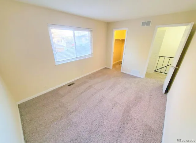 a view of hardwood floor and staircase