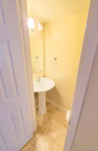 a bathroom with a sink and mirror