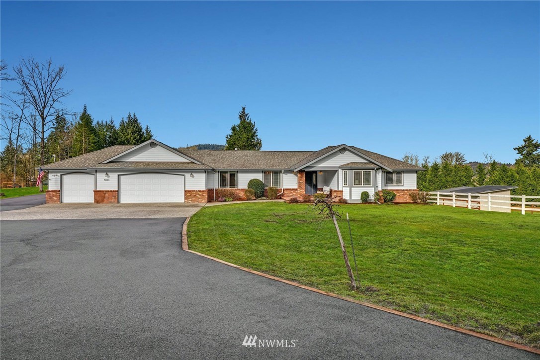 15123 High Bridge Road Monroe, WA 98272 - Photo 1 of 40 a front view of a house with a yard