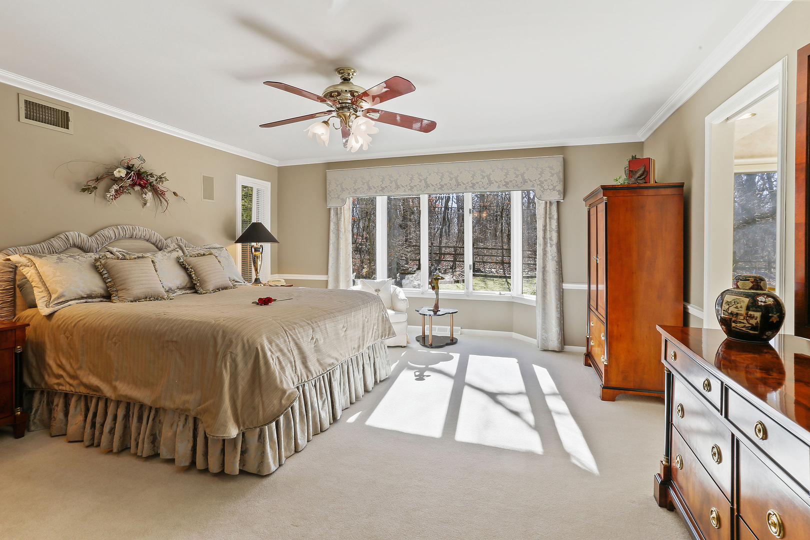43 Ramsgate Drive Palos Park, IL 60464 - Photo 28 of 50 a spacious bedroom with a bed and a chandelier