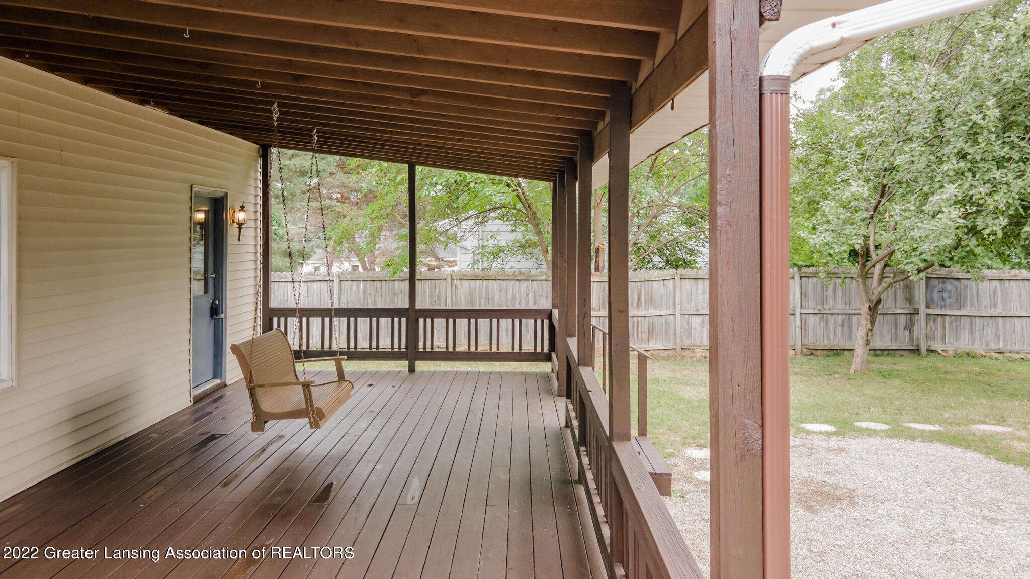 3119 North Aurelius Road Lansing, MI 48910 - Photo 26 of 31 Back deck w/ Swing