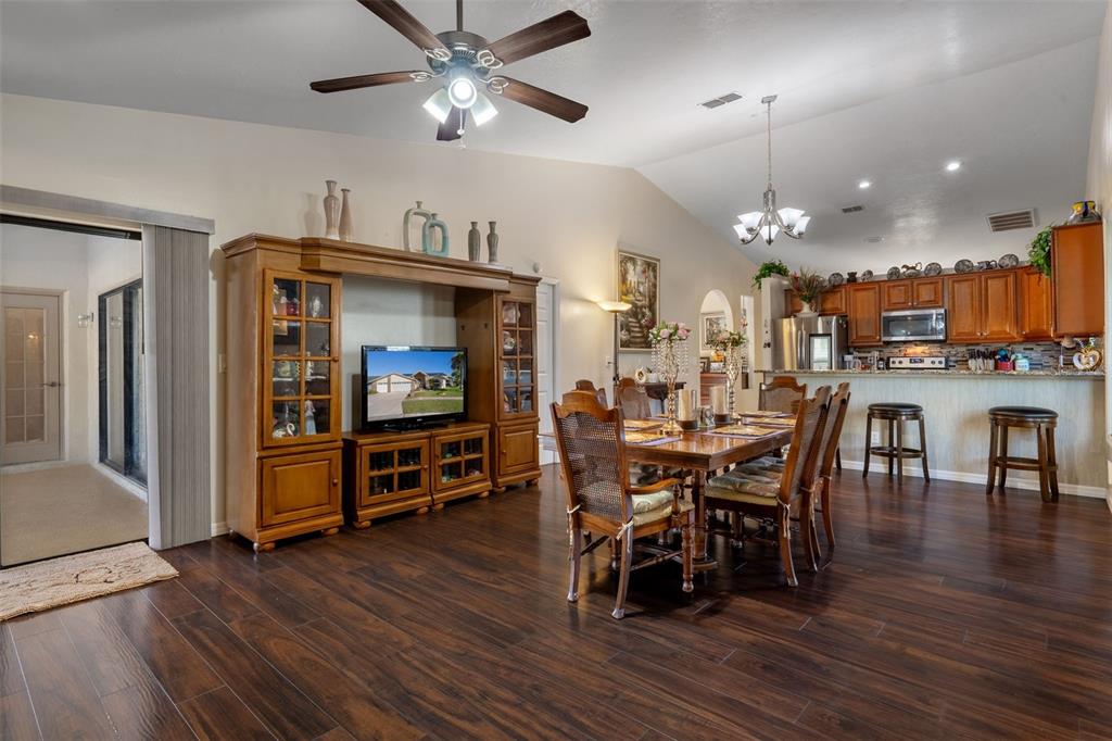 10421 Templewood Court Spring Hill, FL 34608 - Photo 18 of 63 a view of a dining room with furniture and wooden floor