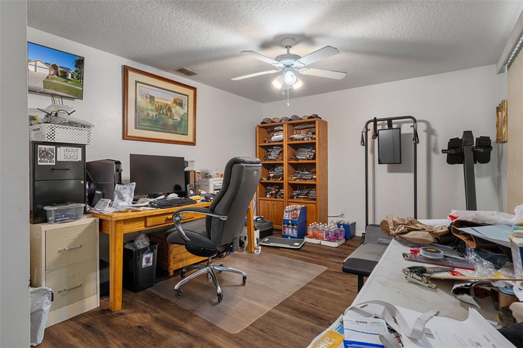 10421 Templewood Court Spring Hill, FL 34608 - Photo 23 of 63 a view of a workspace with furniture and a window