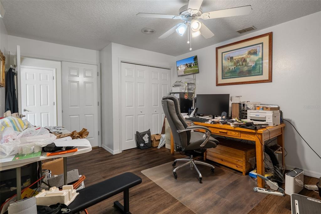10421 Templewood Court Spring Hill, FL 34608 - Photo 24 of 63 a view of a workspace with furniture and a window