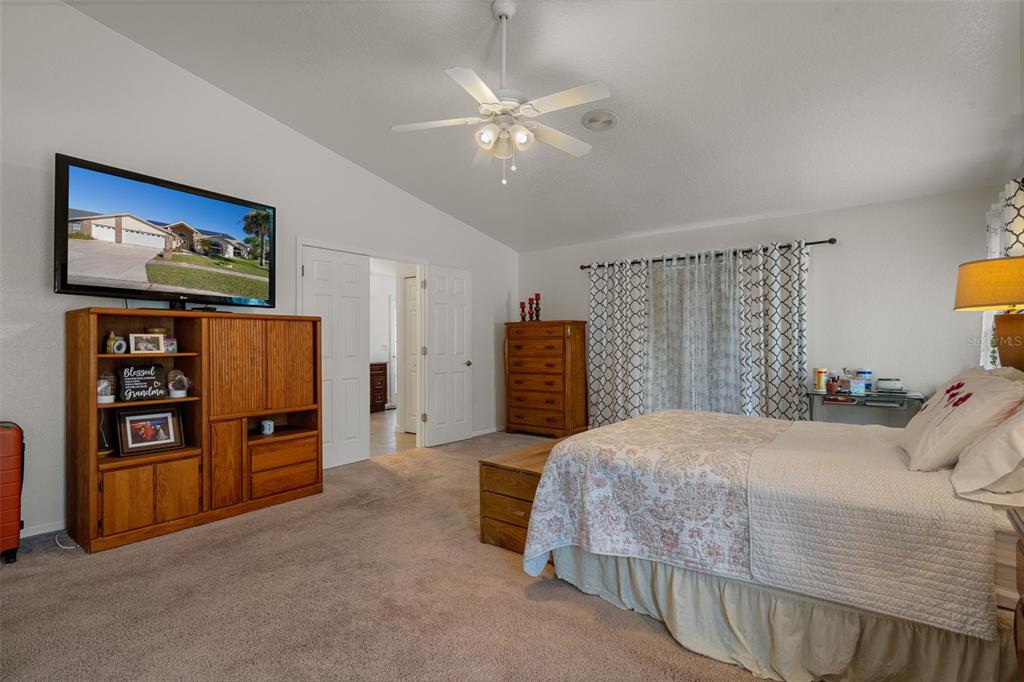 10421 Templewood Court Spring Hill, FL 34608 - Photo 28 of 63 a bedroom with a bed and dresser