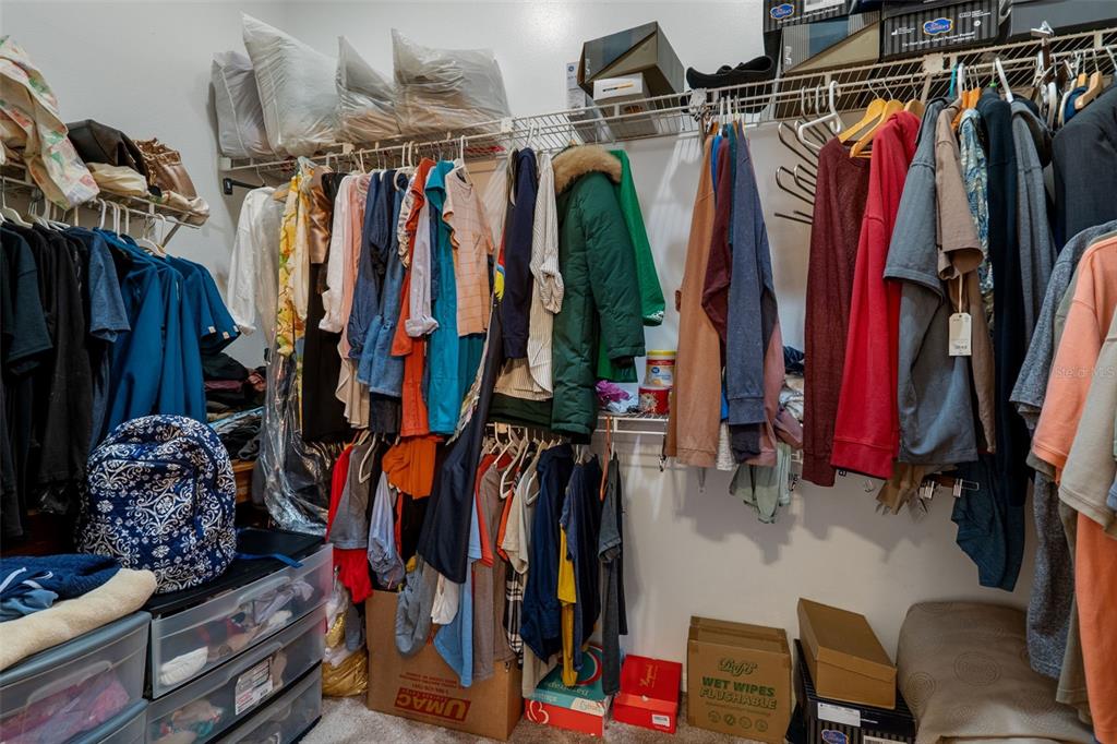 10421 Templewood Court Spring Hill, FL 34608 - Photo 33 of 63 a view of walk in closet with clothes and shoes