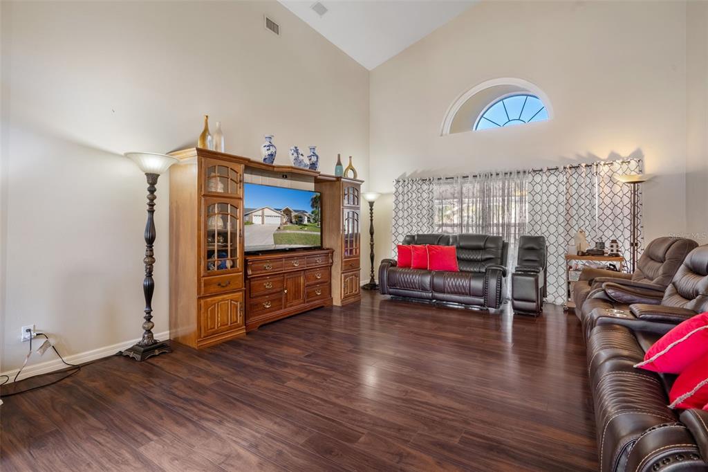 10421 Templewood Court Spring Hill, FL 34608 - Photo 8 of 63 a living room with furniture and a flat screen tv