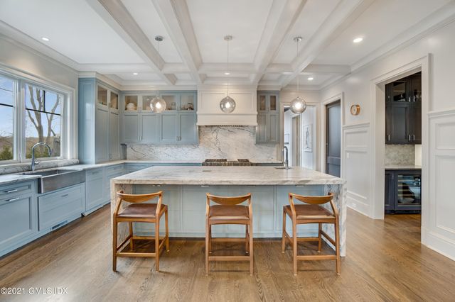 a kitchen with a table and chairs in it