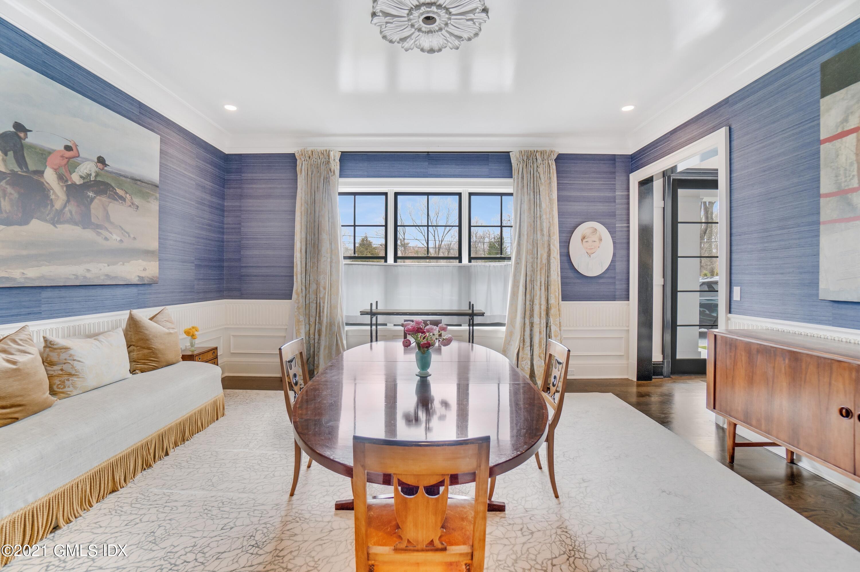 7 Turner Drive Greenwich, CT 06831 - Photo 13 of 34 a living room with furniture and a chandelier