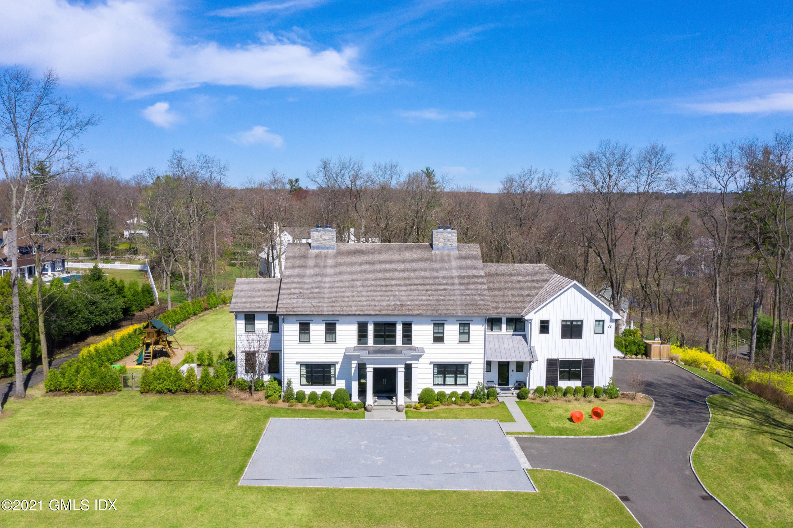 7 Turner Drive Greenwich, CT 06831 - Photo 2 of 34 a view of a house with swimming pool and sitting area