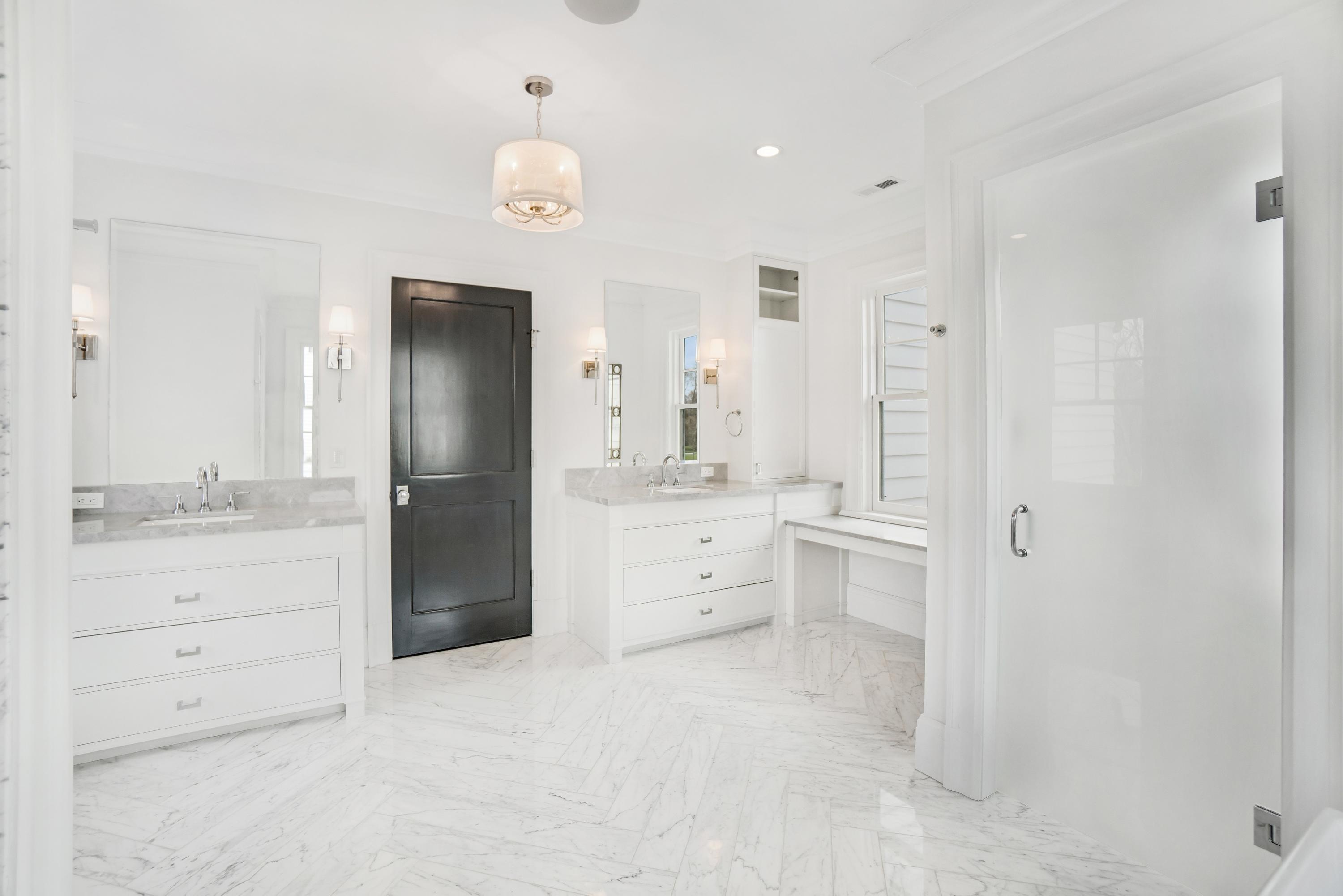 7 Turner Drive Greenwich, CT 06831 - Photo 24 of 34 a bathroom with a granite countertop sink mirror and a shower