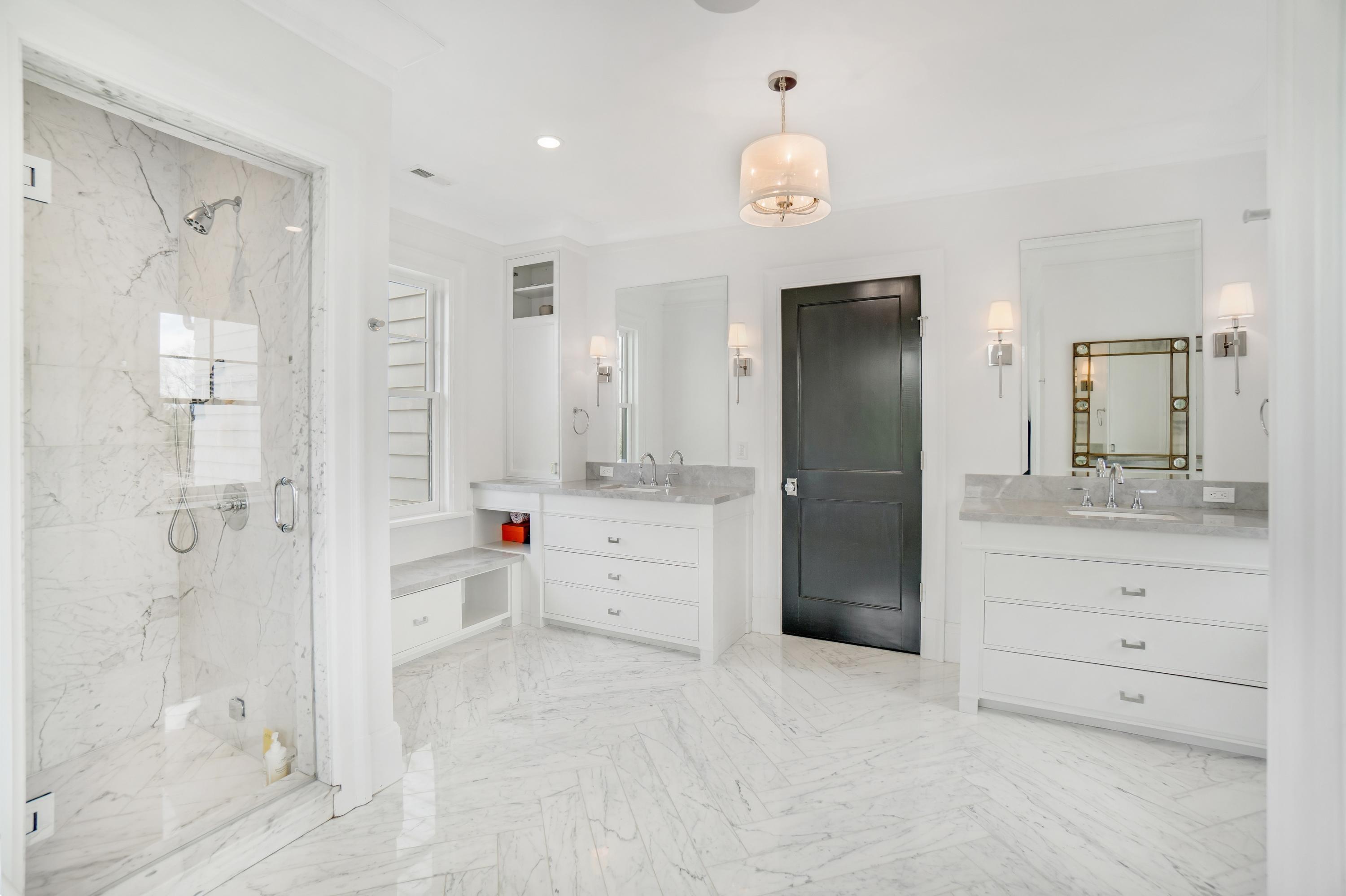 7 Turner Drive Greenwich, CT 06831 - Photo 25 of 34 a bathroom with a shower sink and mirror