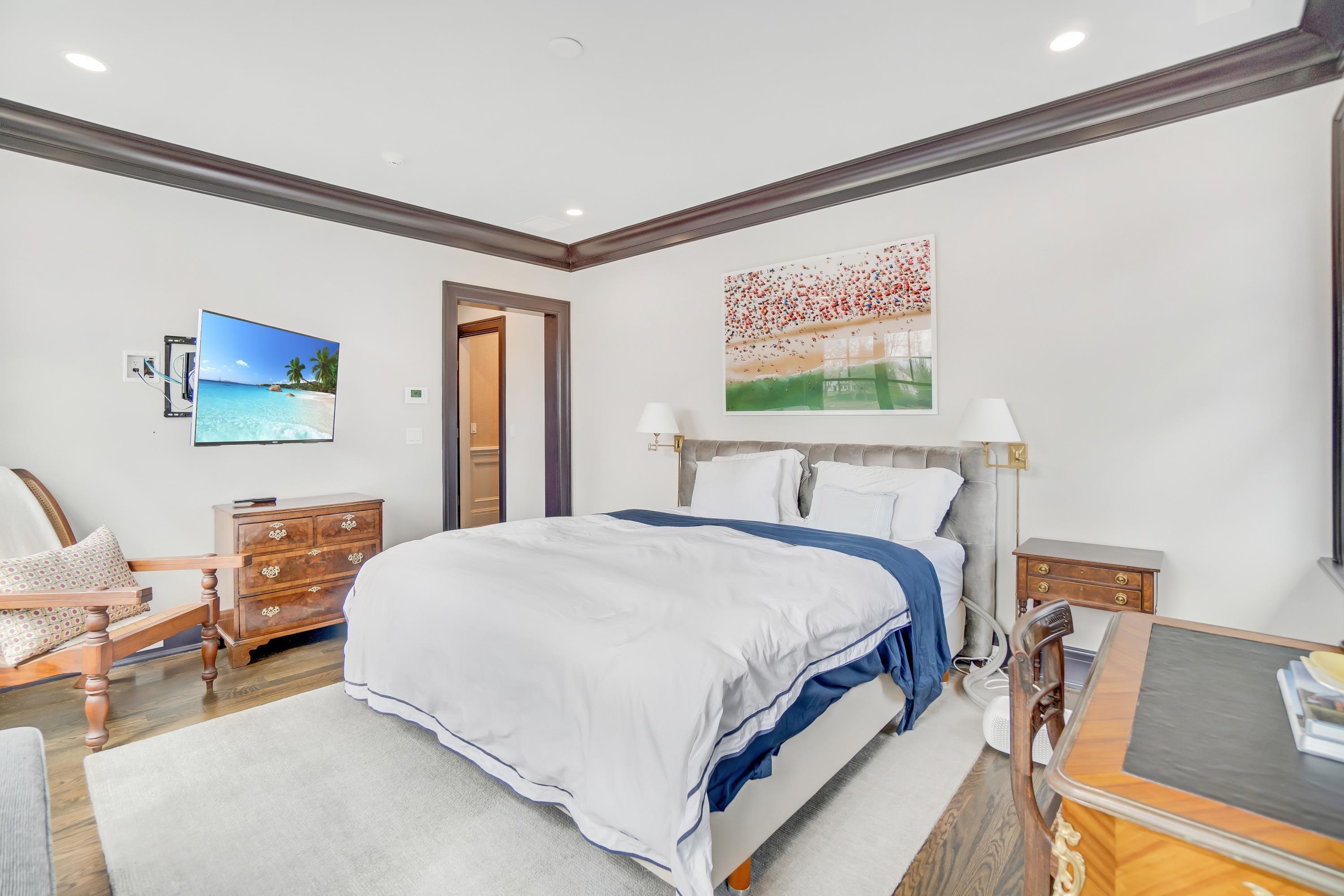 7 Turner Drive Greenwich, CT 06831 - Photo 27 of 34 a bedroom with a bed and dresser