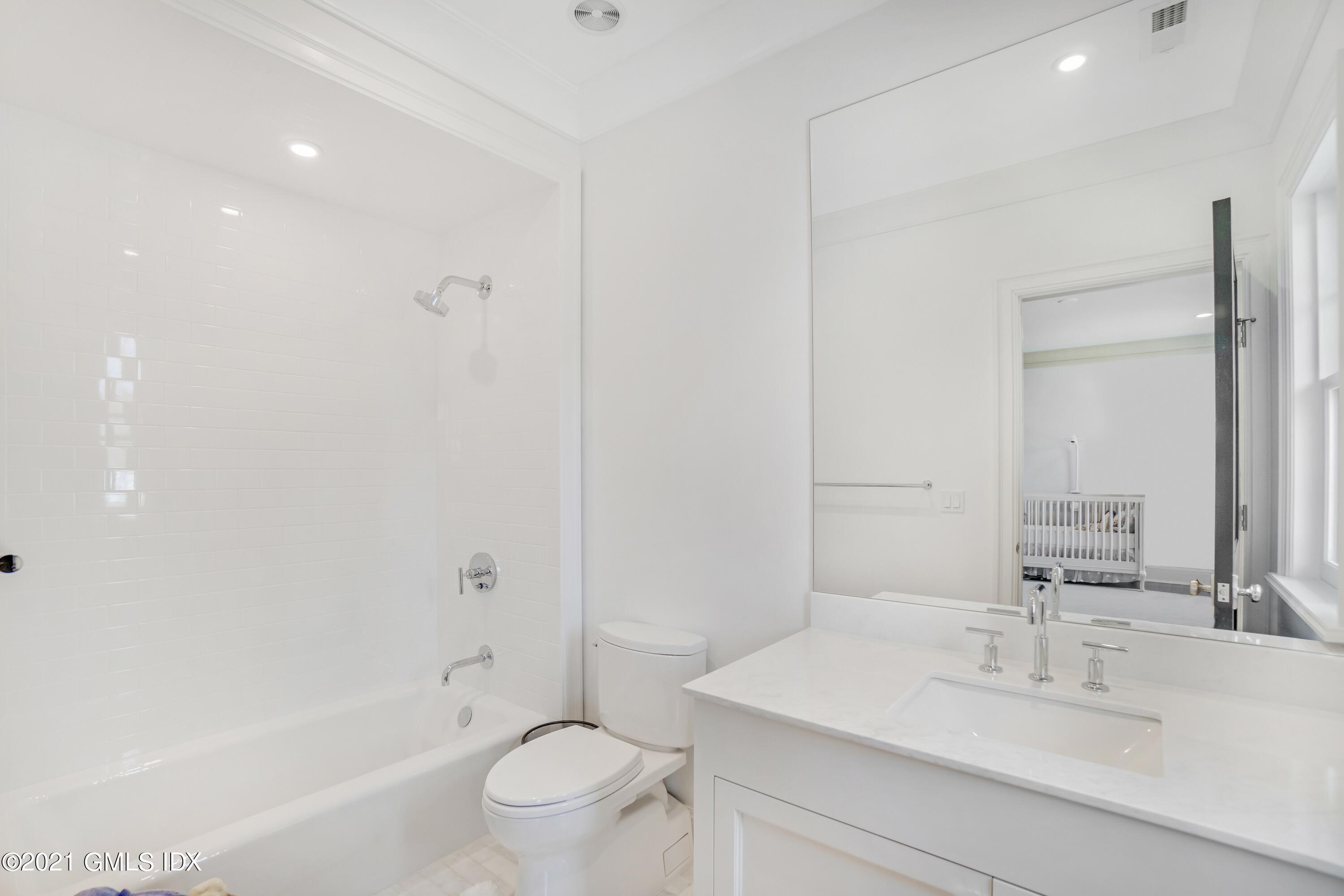 7 Turner Drive Greenwich, CT 06831 - Photo 30 of 34 a bathroom with a sink a toilet and shower