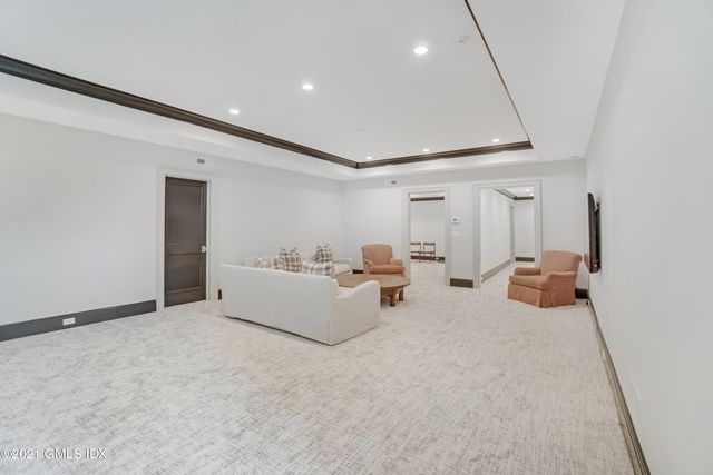 a bed room with furniture and a ceiling fan