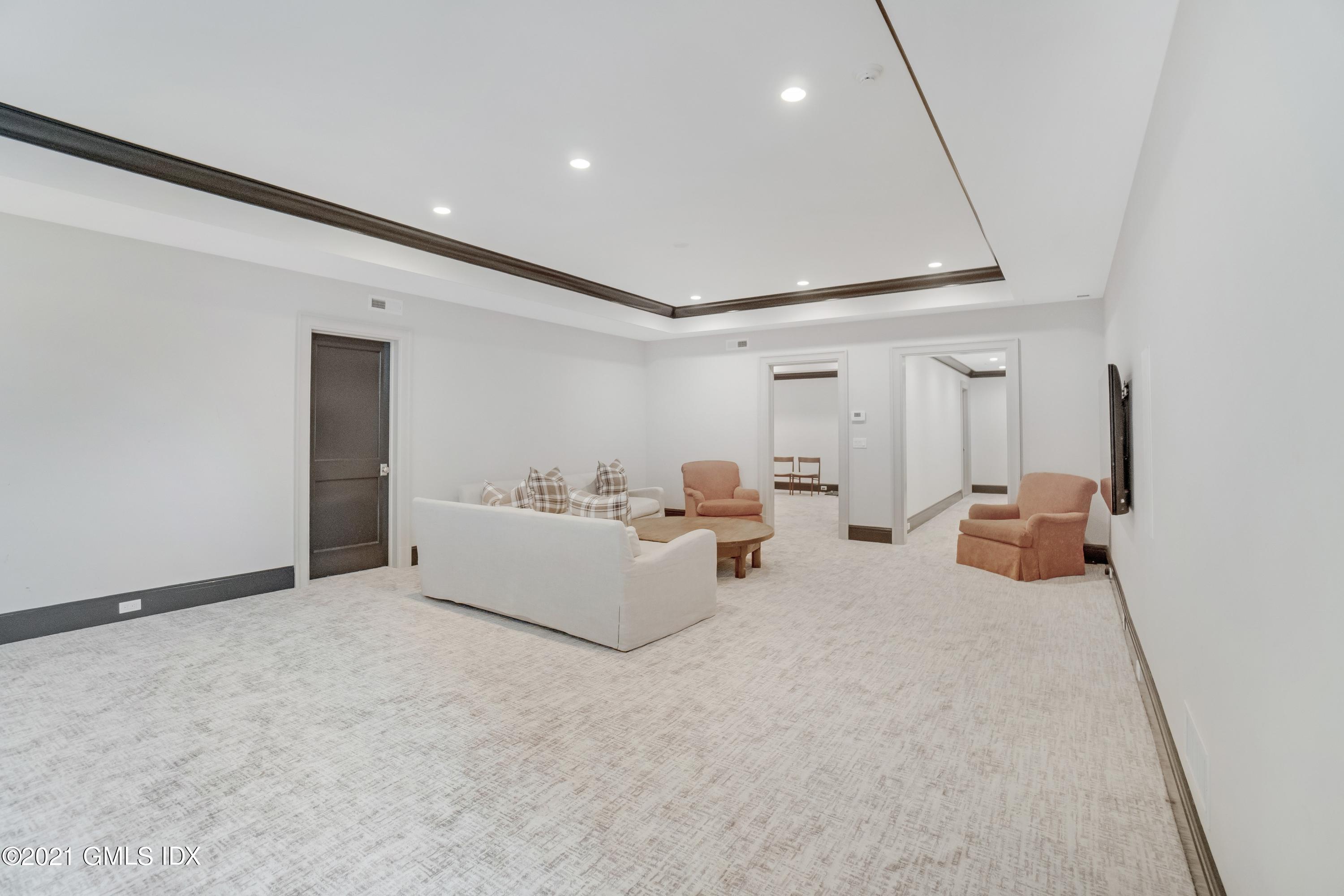 7 Turner Drive Greenwich, CT 06831 - Photo 33 of 34 a bed room with furniture and a ceiling fan