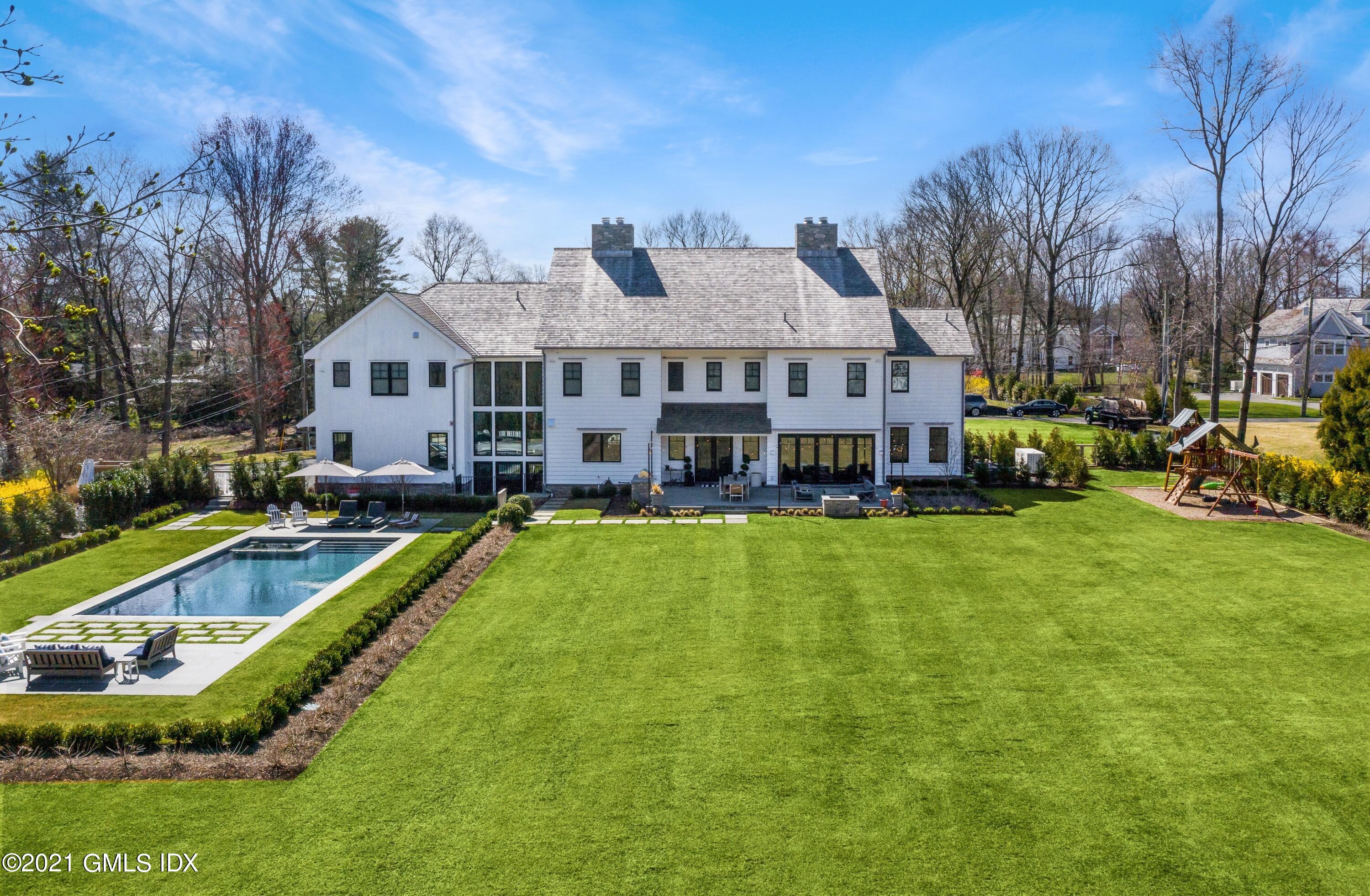 7 Turner Drive Greenwich, CT 06831 - Photo 5 of 34 a view of a house with a big yard and sitting area