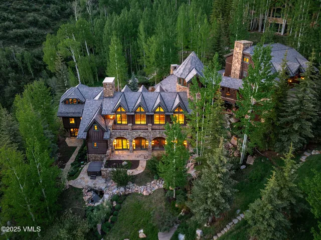 an aerial view of a house with outdoor space pool seating area and yard