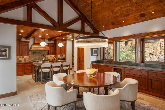 a dining room with furniture and wooden floor