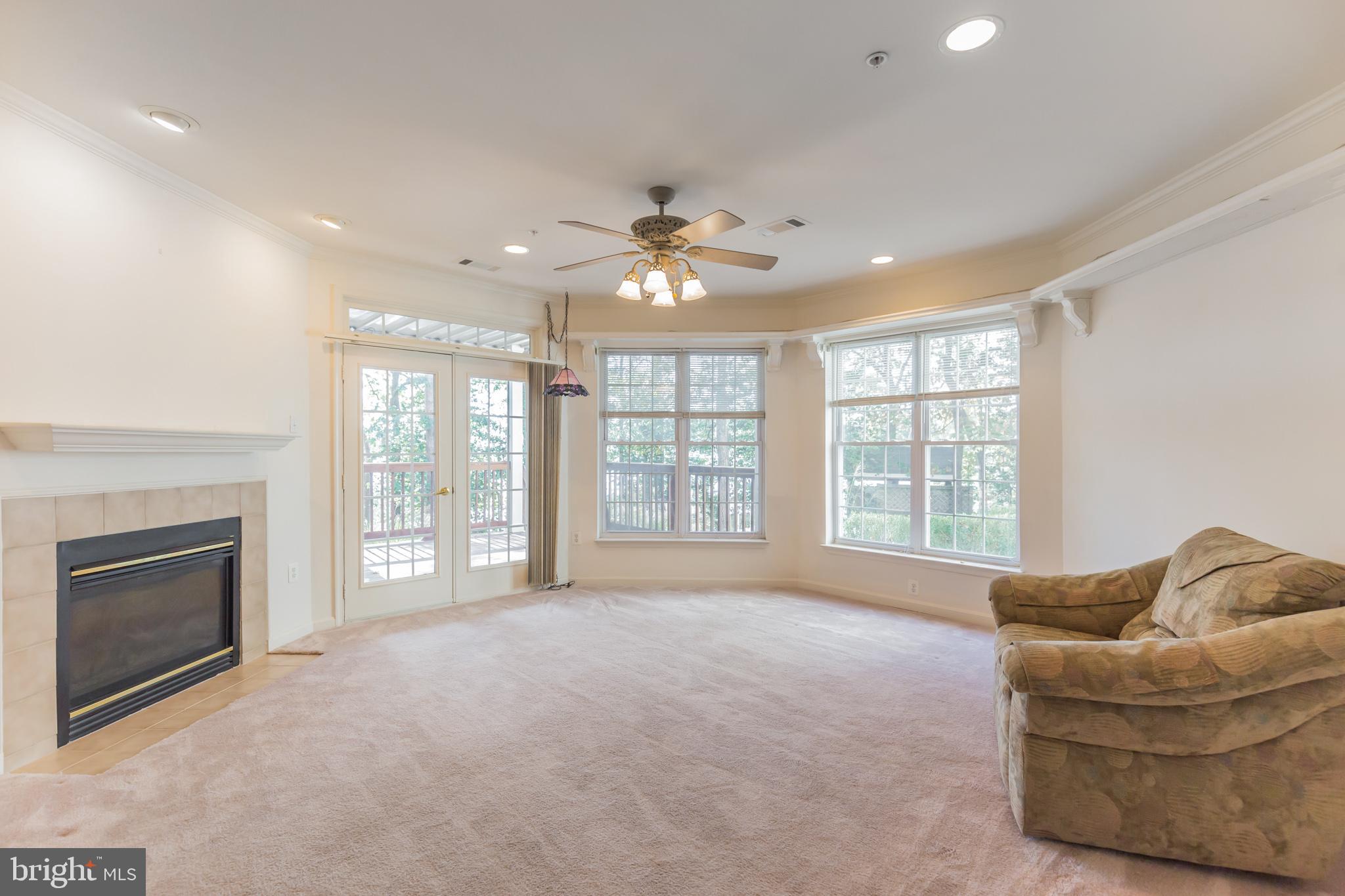 605 Runabout Loop Solomons, MD 20688 - Photo 7 of 31 Front room w/fireplace great view of water