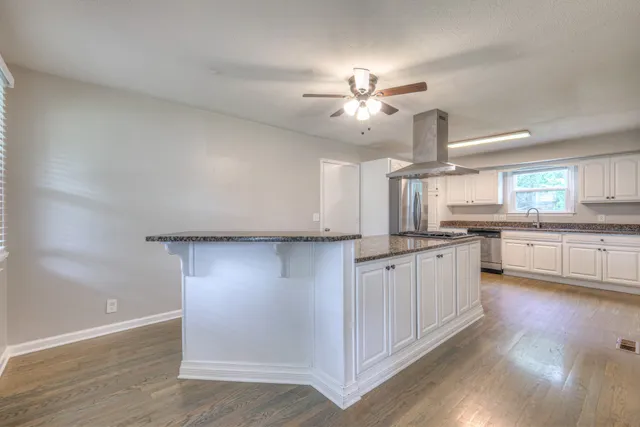 a view of a kitchen with electric appliances