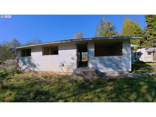 a black and white photo of a house