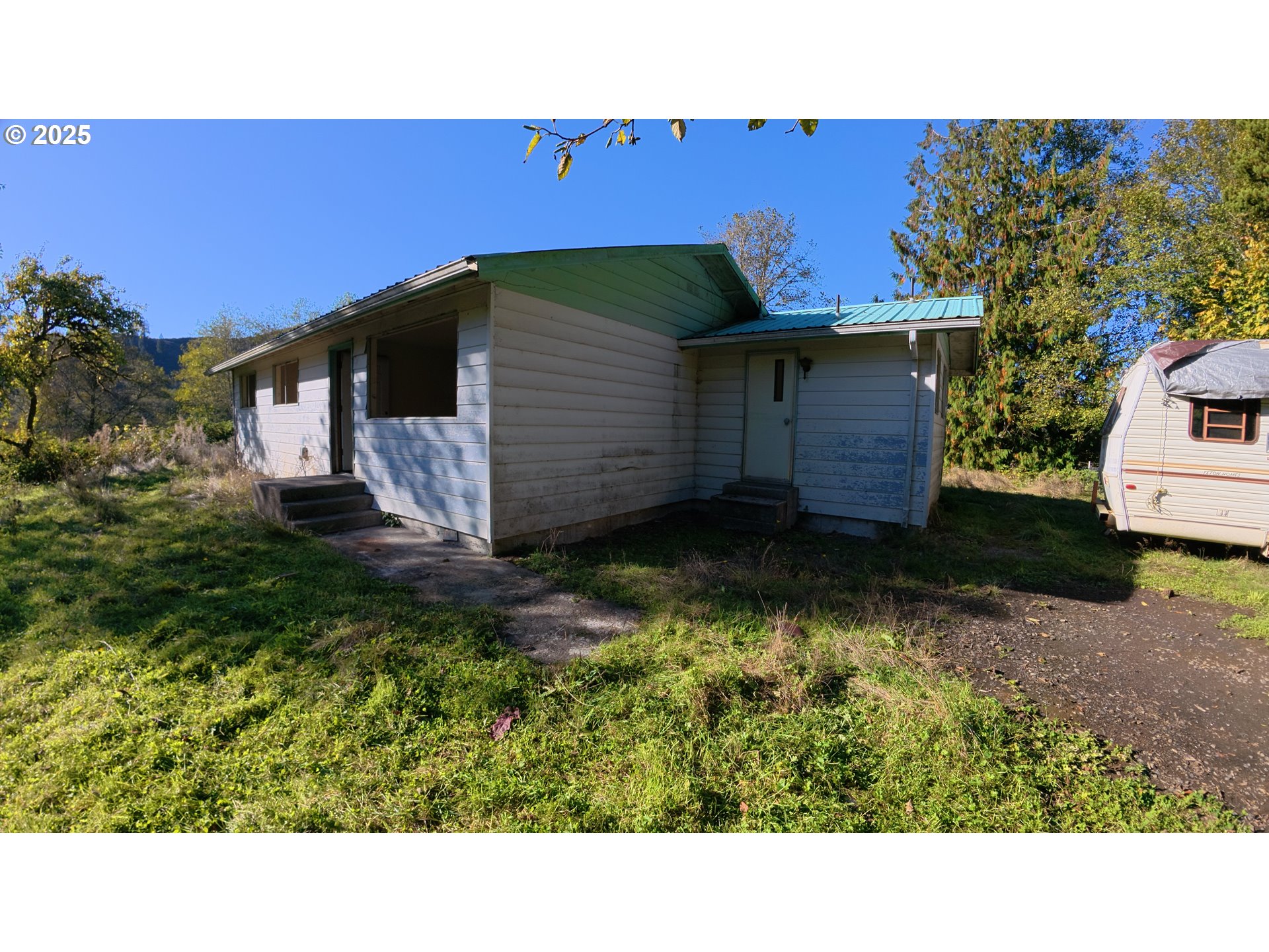 105 East Valley Road Skamokawa, WA 98647 - Photo 19 of 29 a black and white house with a yard