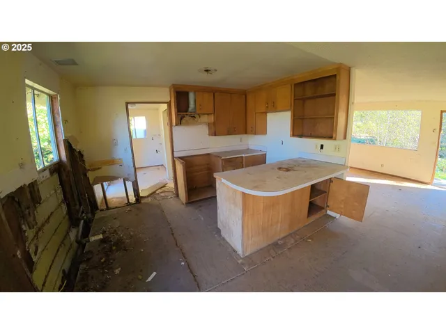 a open area with a floor to ceiling window