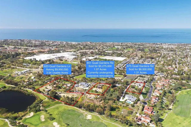 an aerial view of residential building and ocean