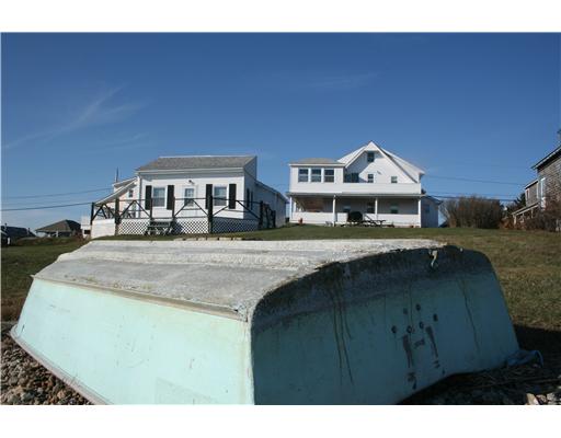 51 Prospect Road South Kingstown, RI 02879 - Photo 2 of 12 Exterior Back. Guest Cottage and Main House fromt he water s edge
