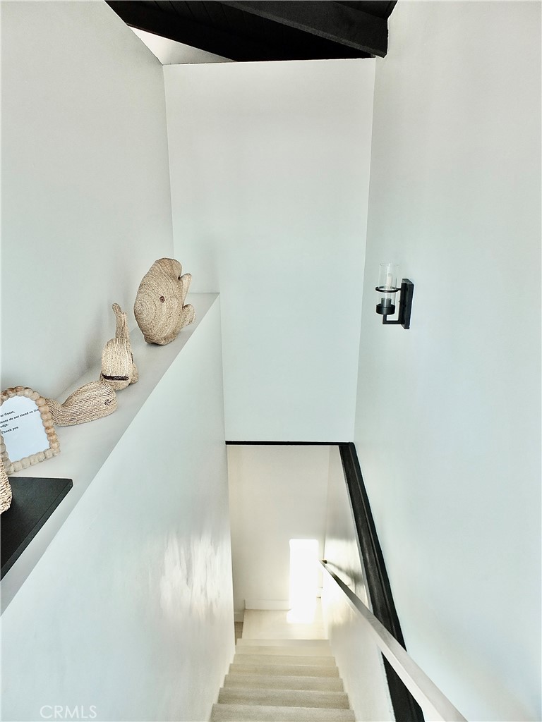 16765 South Pacific Avenue, Unit B' Huntington Beach, CA 90742 - Photo 17 of 45 a view of staircase with white walls