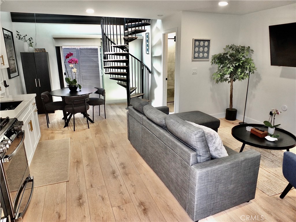 16765 South Pacific Avenue, Unit B' Huntington Beach, CA 90742 - Photo 8 of 45 a living room with furniture and a flat screen tv