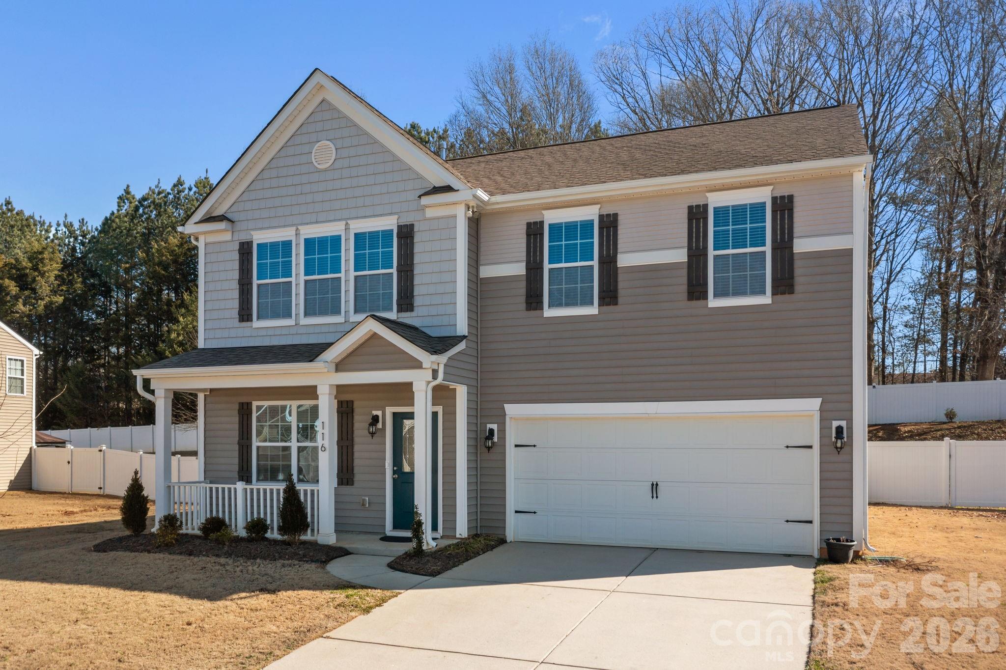 116 Rippling Water Drive Mount Holly, NC 28120 - Photo 2 of 48 a front view of a house with a yard