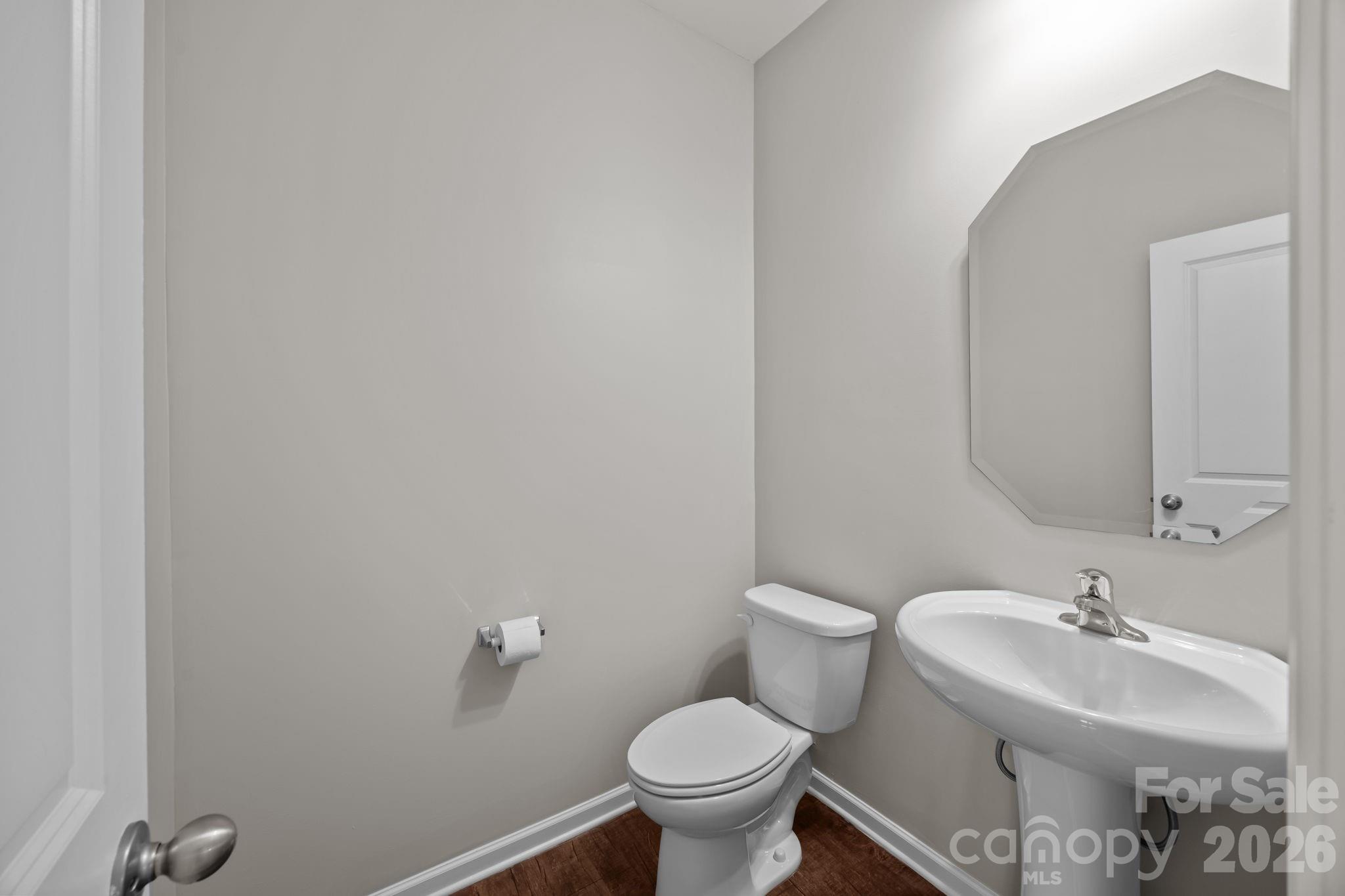 116 Rippling Water Drive Mount Holly, NC 28120 - Photo 21 of 48 a bathroom with a sink mirror and toilet